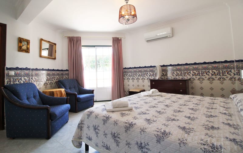 Double bedroom with armchairs
