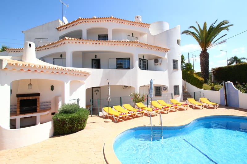 The pool and the villa's outdoor barbecue area