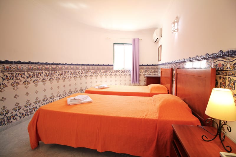 Bedroom with orange covers