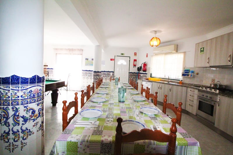 Kitchen and dining area with tiled walls