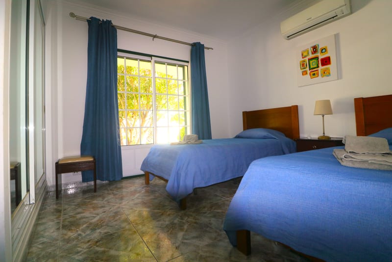 Twin bedroom with blue covers